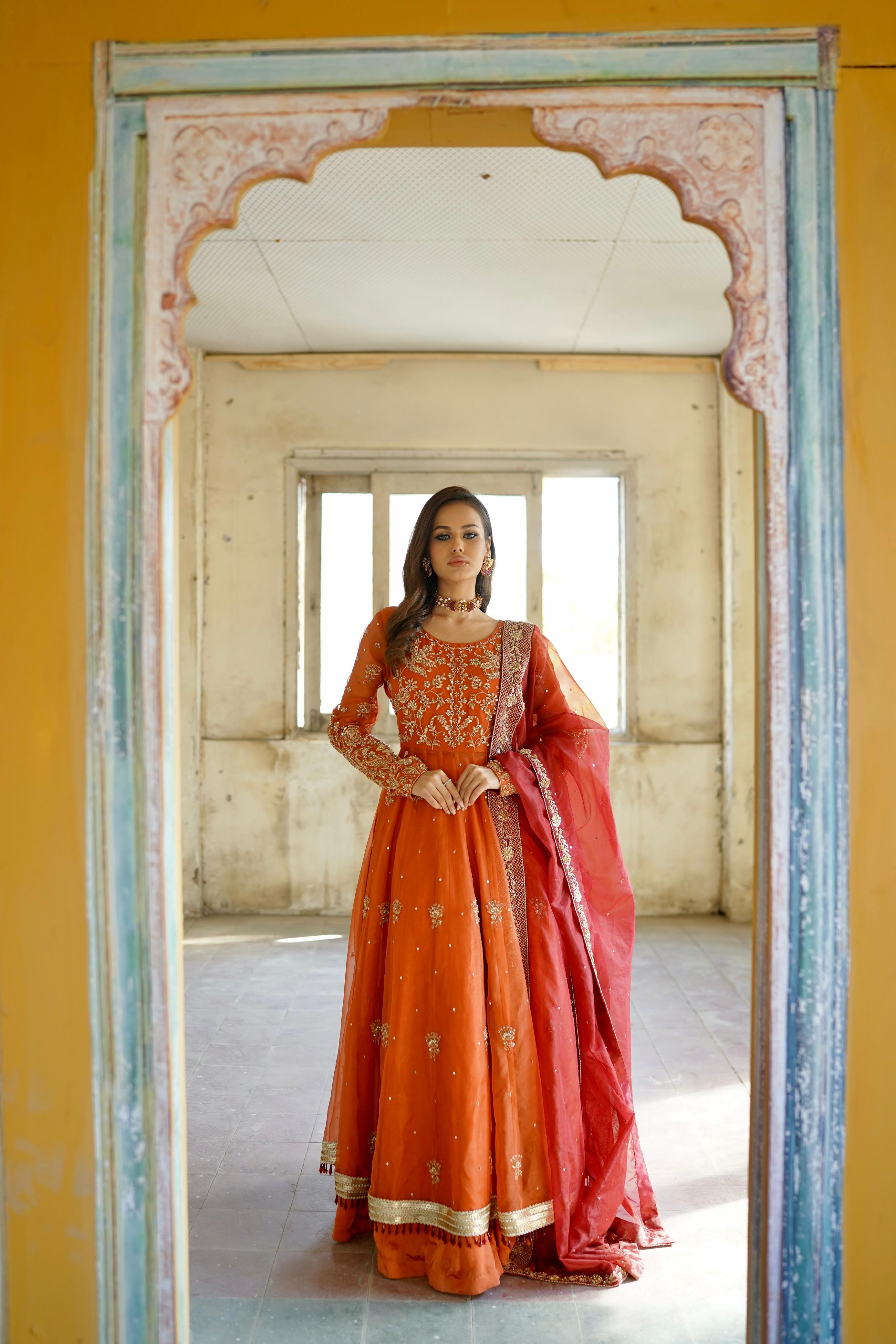 ZEBAISH E ZAMANA ( ORANGE/RED DRESS)