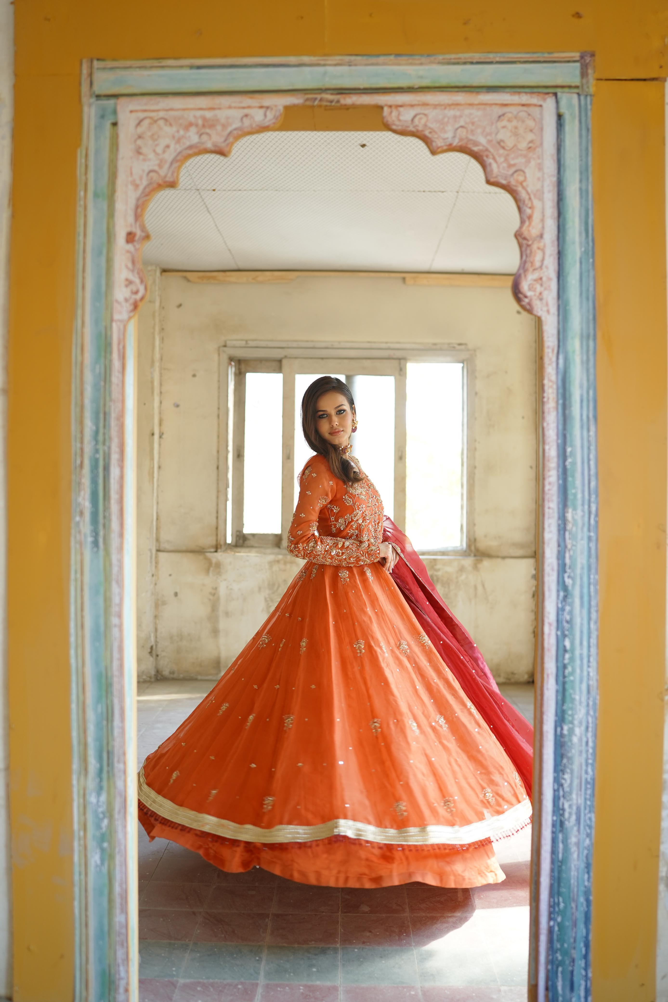ZEBAISH E ZAMANA ( ORANGE/RED DRESS)