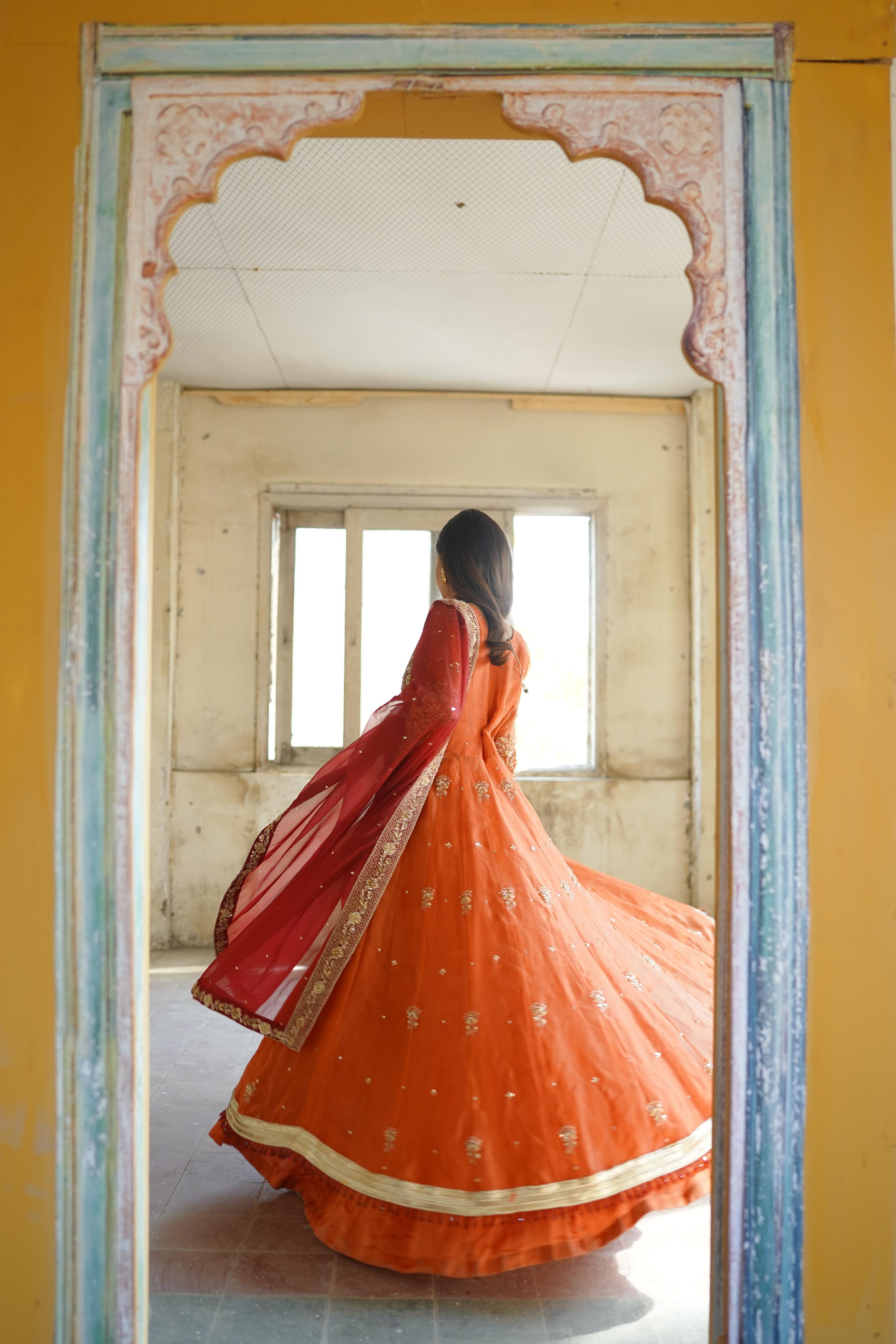 ZEBAISH E ZAMANA ( ORANGE/RED DRESS)