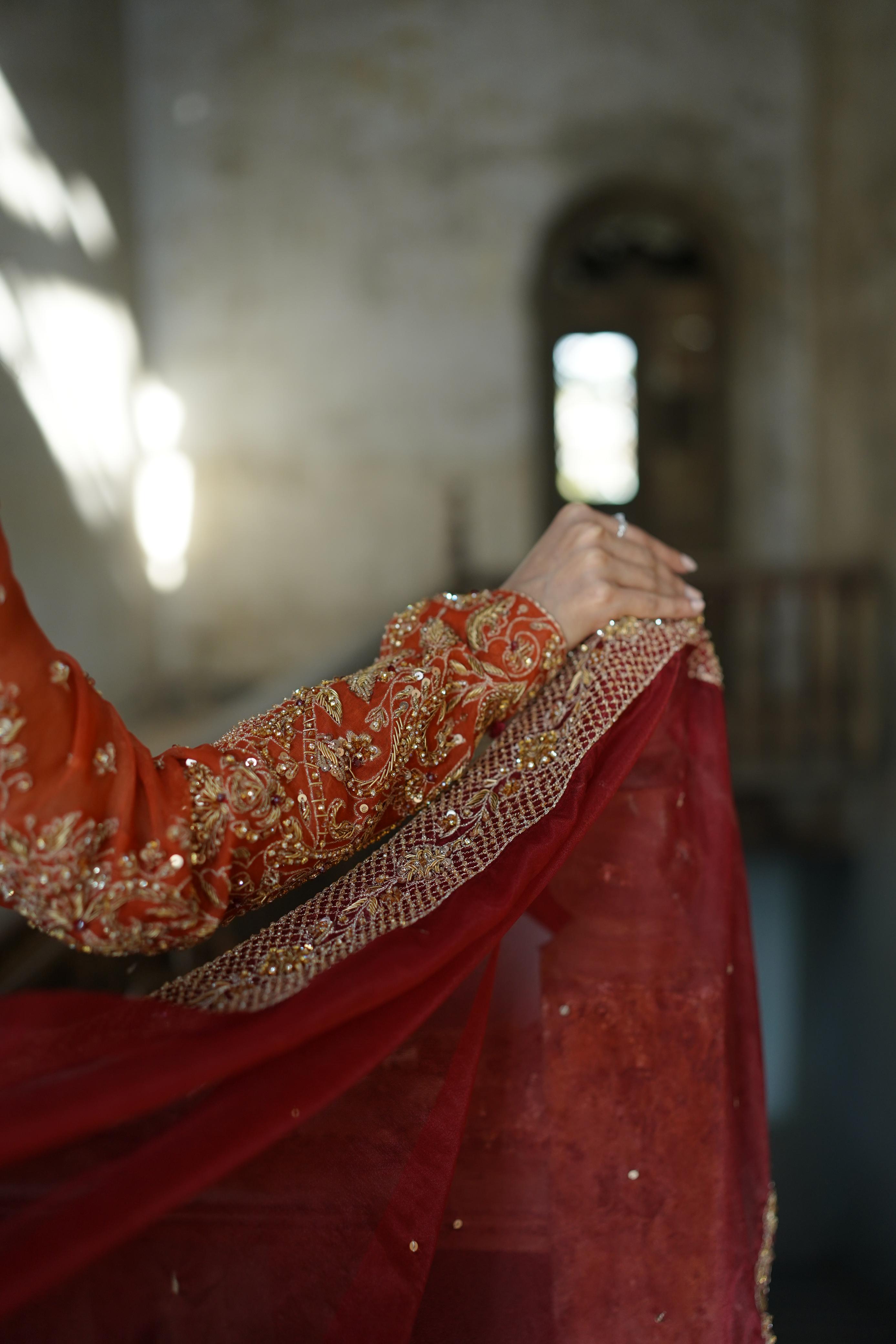 ZEBAISH E ZAMANA ( ORANGE/RED DRESS)