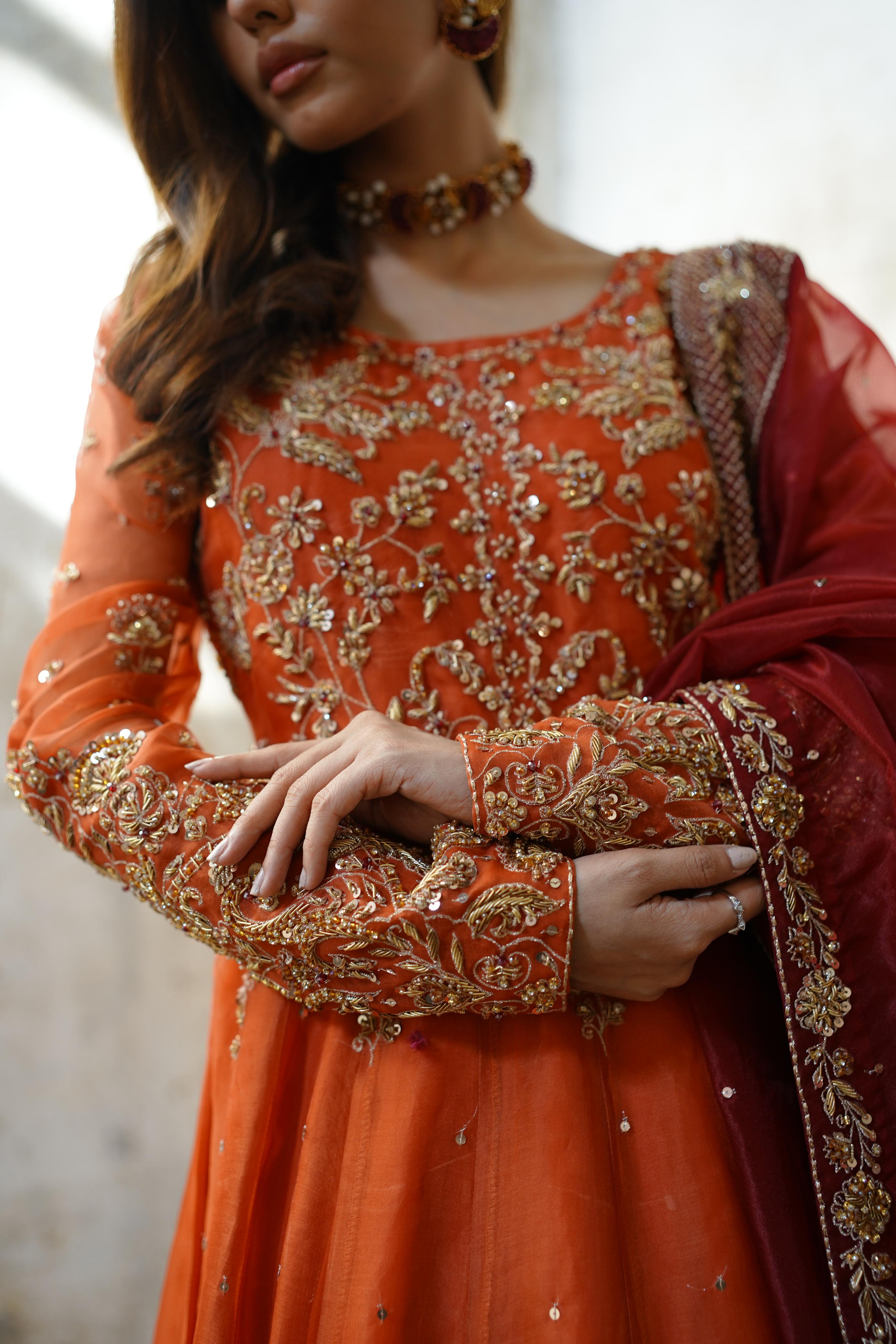 ZEBAISH E ZAMANA ( ORANGE/RED DRESS)