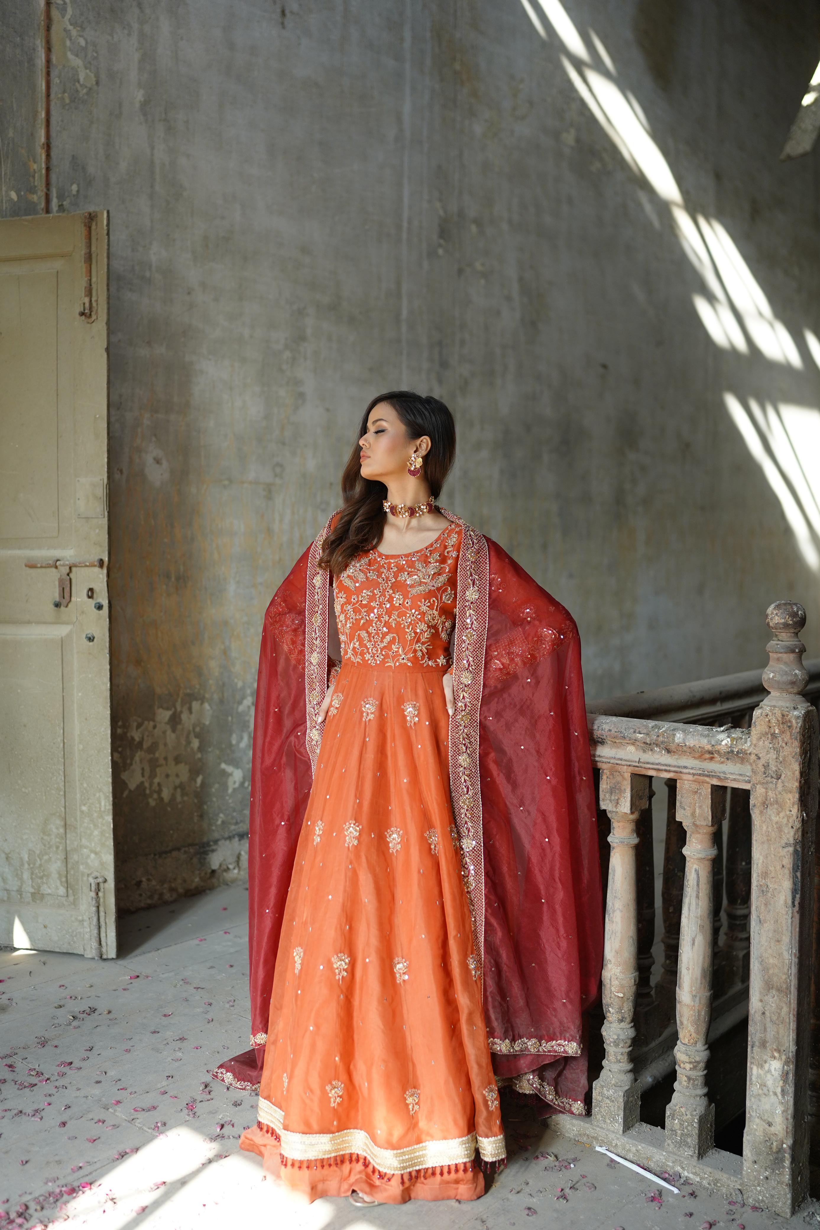 ZEBAISH E ZAMANA ( ORANGE/RED DRESS)